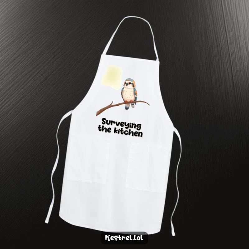 Funny kestrel apron showing a curious bird perched on a thin branch, looking around the kitchen.