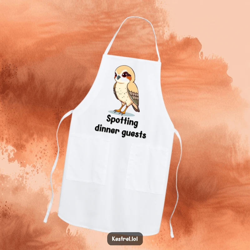 Funny apron showcasing a kestrel character with sharp eyes, scanning the ground below, perfect for focused kitchen fun.