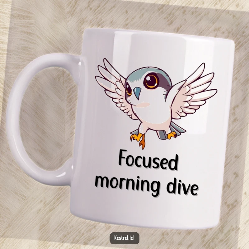 Funny kestrel mug depicting a determined kestrel character diving sharply downwards with intensely focused eyes, embodying precision.