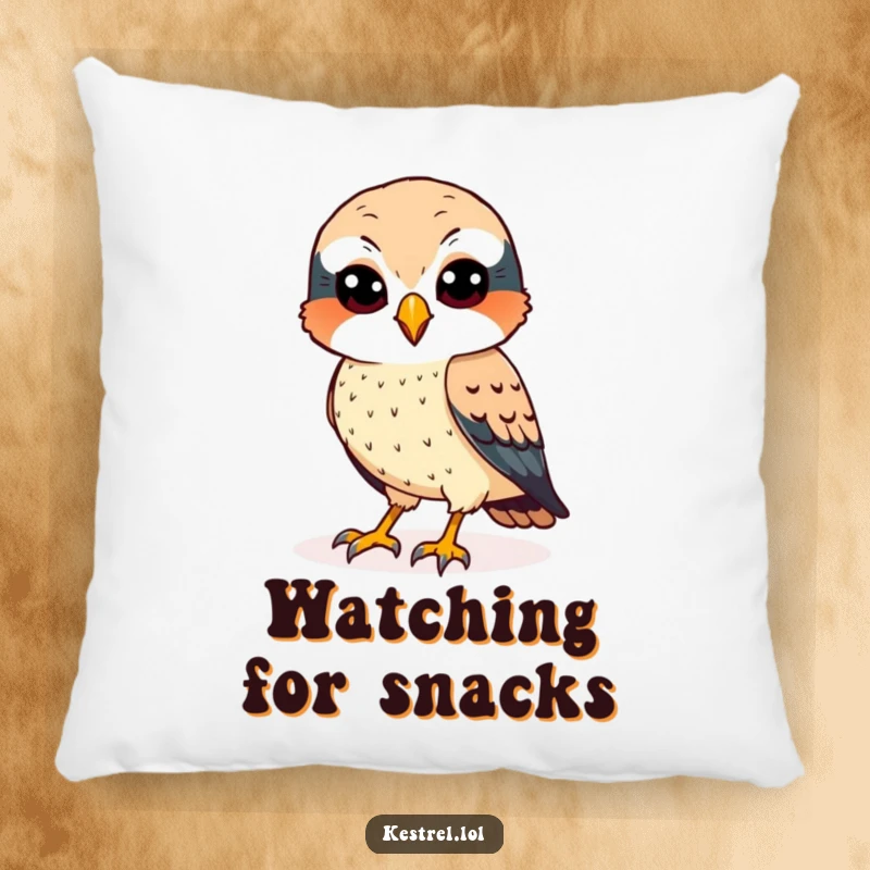 Funny kestrel pillow featuring a cheerful bird with sharp eyes, scanning the ground, adding humor and comfort.