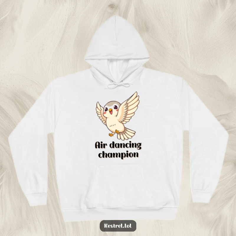 Funny kestrel hoodie illustrating a joyful kestrel character swooping playfully, offering warmth and spirited humor.
