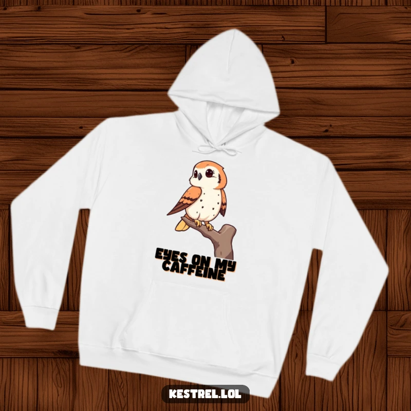 Funny kestrel hoodie featuring a bird of prey keenly observing from a high perch, ideal for thoughtful relaxation.