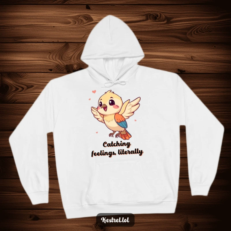 Funny kestrel hoodie depicting a gleeful bird character embraced by a playful breeze, offering cozy, humorous warmth for all.