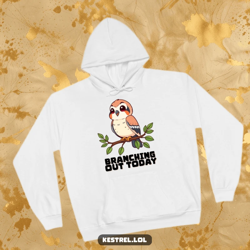 Funny kestrel hoodie showing a happy bird perched on a stylized branch, looking around. Cozy and humorous.