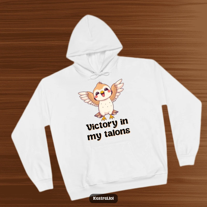 Funny kestrel hoodie showing a joyful bird with open wings, celebrating a successful catch. Cozy and humorous.