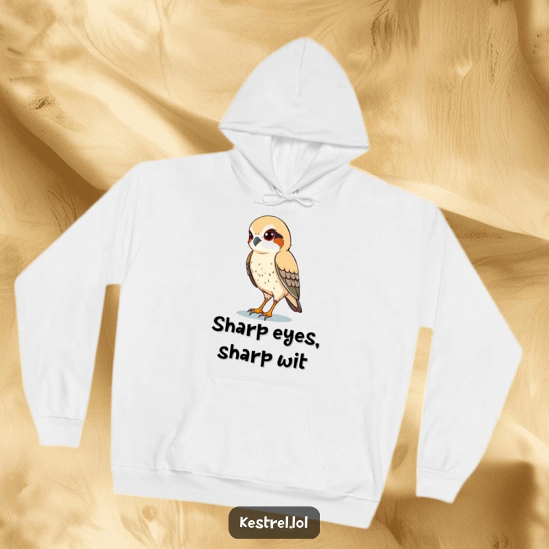Funny hoodie depicting a kestrel character with sharp eyes, diligently scanning the terrain below with intense focus.