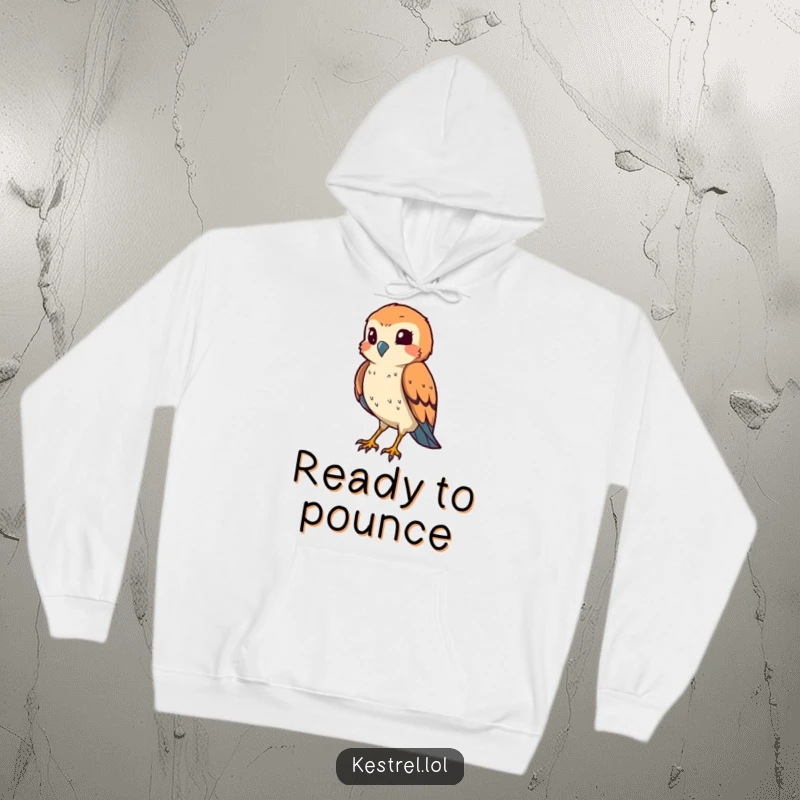 Funny kestrel hoodie showing a smiling bird squinting its eye in a hunting pose, offering warmth and humor.