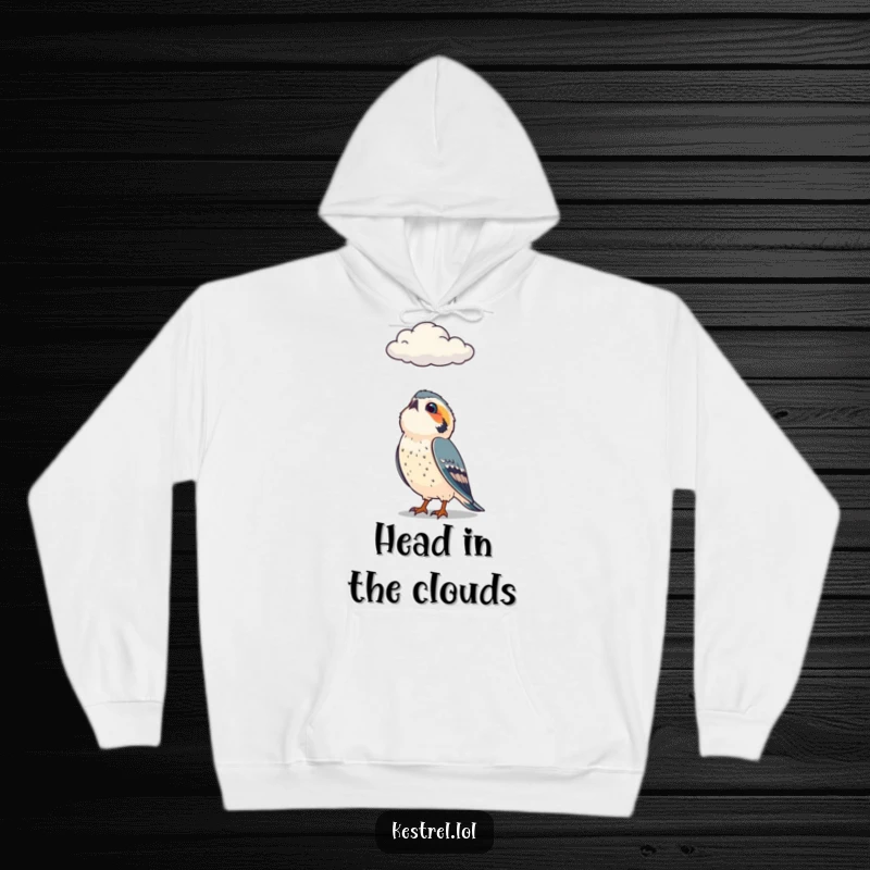 Funny hoodie depicting a curious kestrel character looking up at a passing cloud, designed for cozy contemplation.