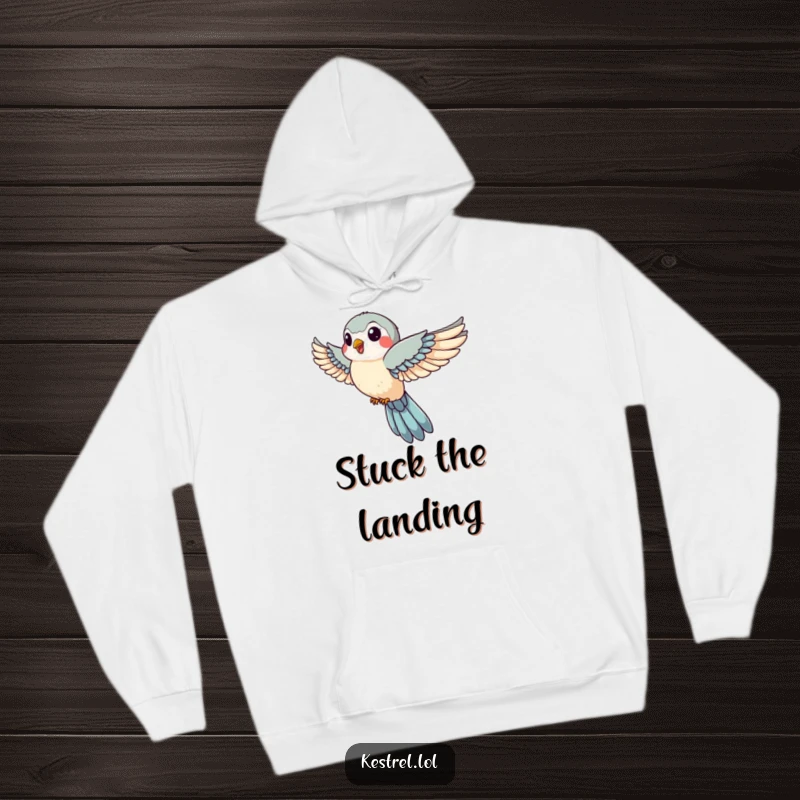 Funny hoodie featuring a jovial kestrel with wings tucked in swift descent, offering warmth and a humorous symbol of focused speed.