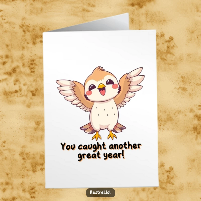 Funny Free Printable Birthday Card: A joyful kestrel celebrating a successful catch with its wings spread wide in victory.