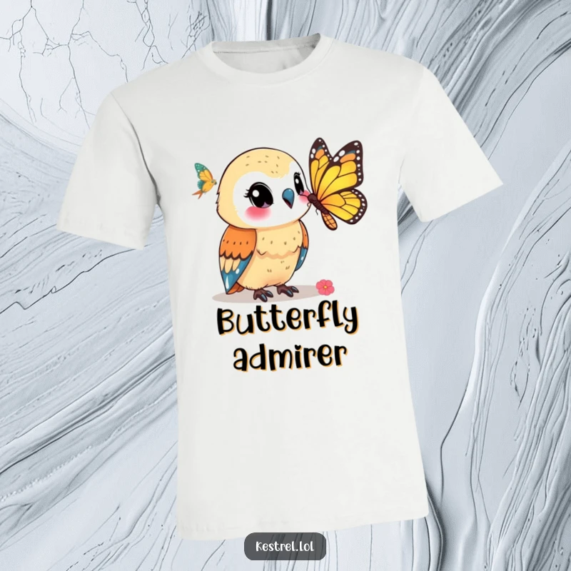 Funny kestrel t-shirt depicting a smiling kestrel character observing a butterfly, symbolizing peace and appreciation for nature.
