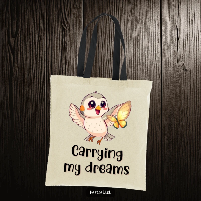 Funny tote bag showing a happy kestrel with big eyes playfully chasing a shimmering butterfly, perfect for everyday use.