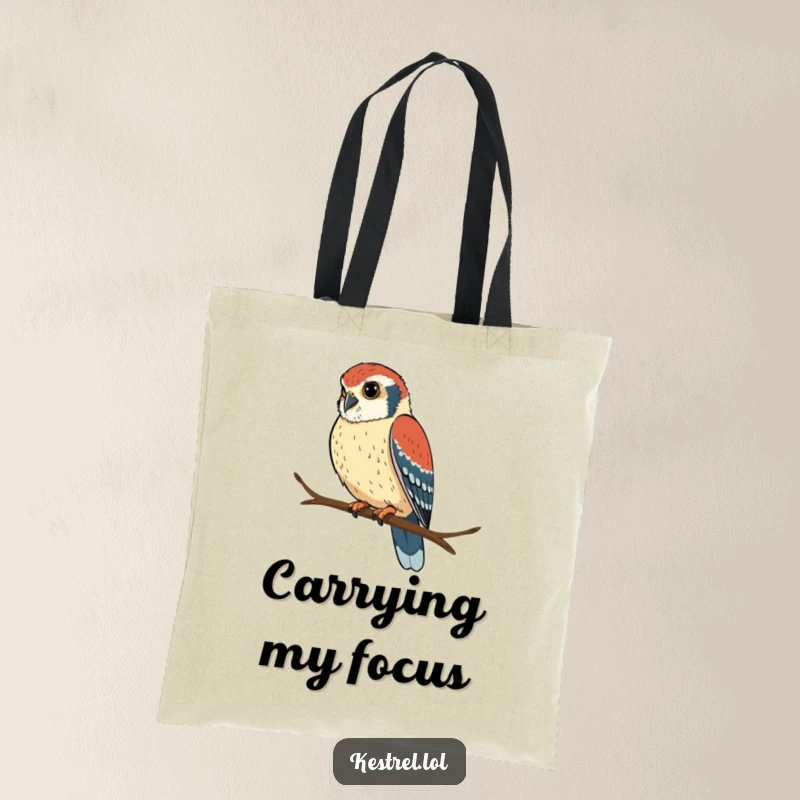 Funny kestrel tote bag with a determined bird perched and looking intently, ideal for carrying essentials humorously.